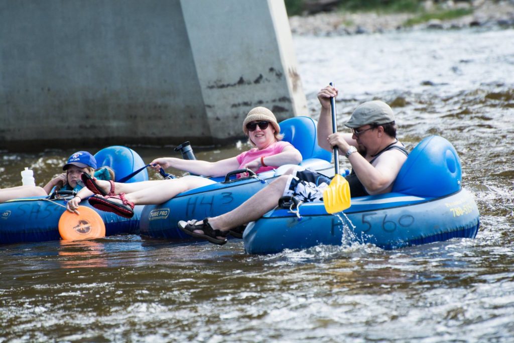 People floating on tubes down a river