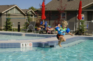 Boy Jumping Into Pool