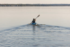 woman kayaking on lake